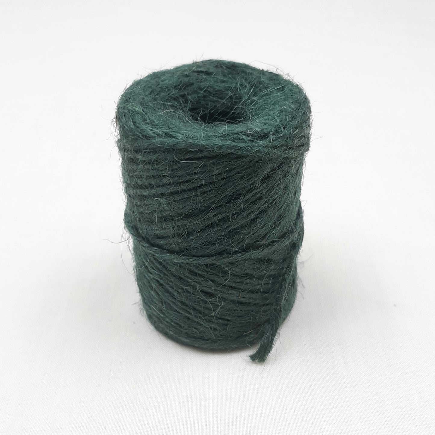 A roll of Green Jute Mossing Twine for crafting and floristry.