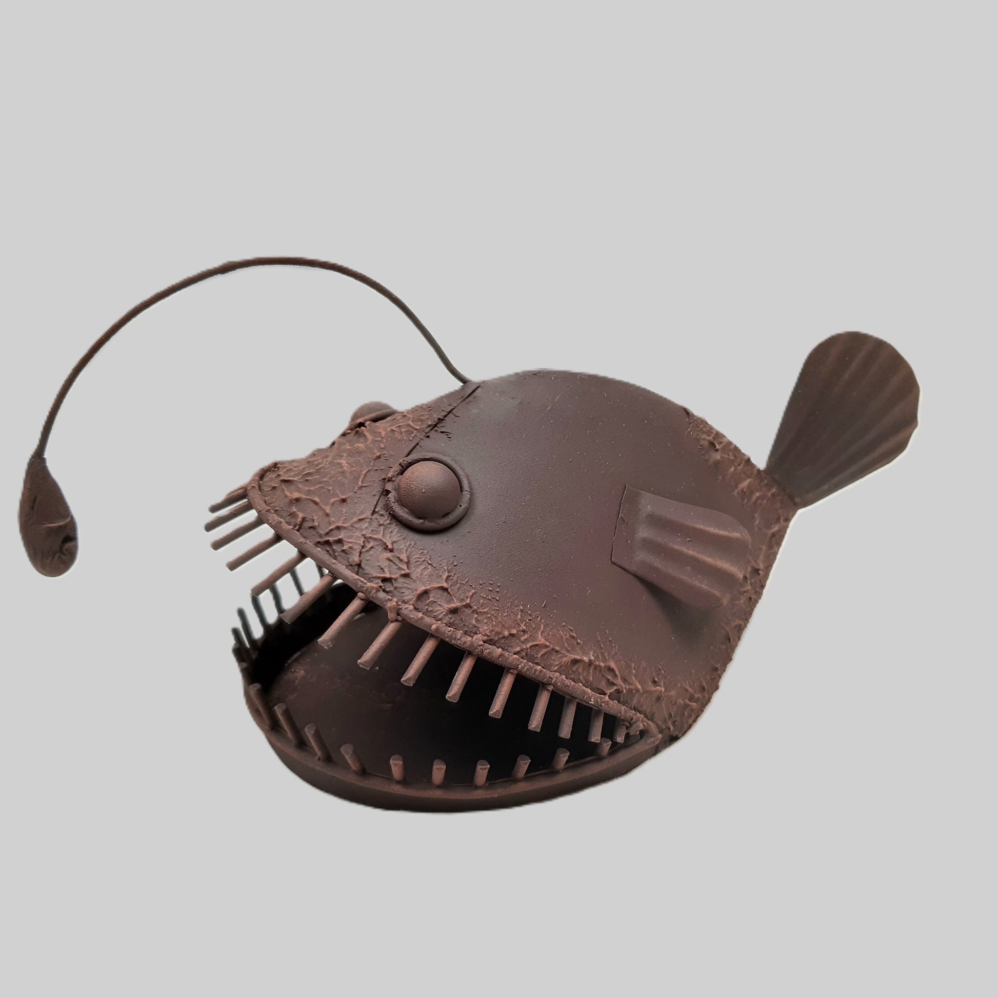 A rust style angler fish ornament called Allan 