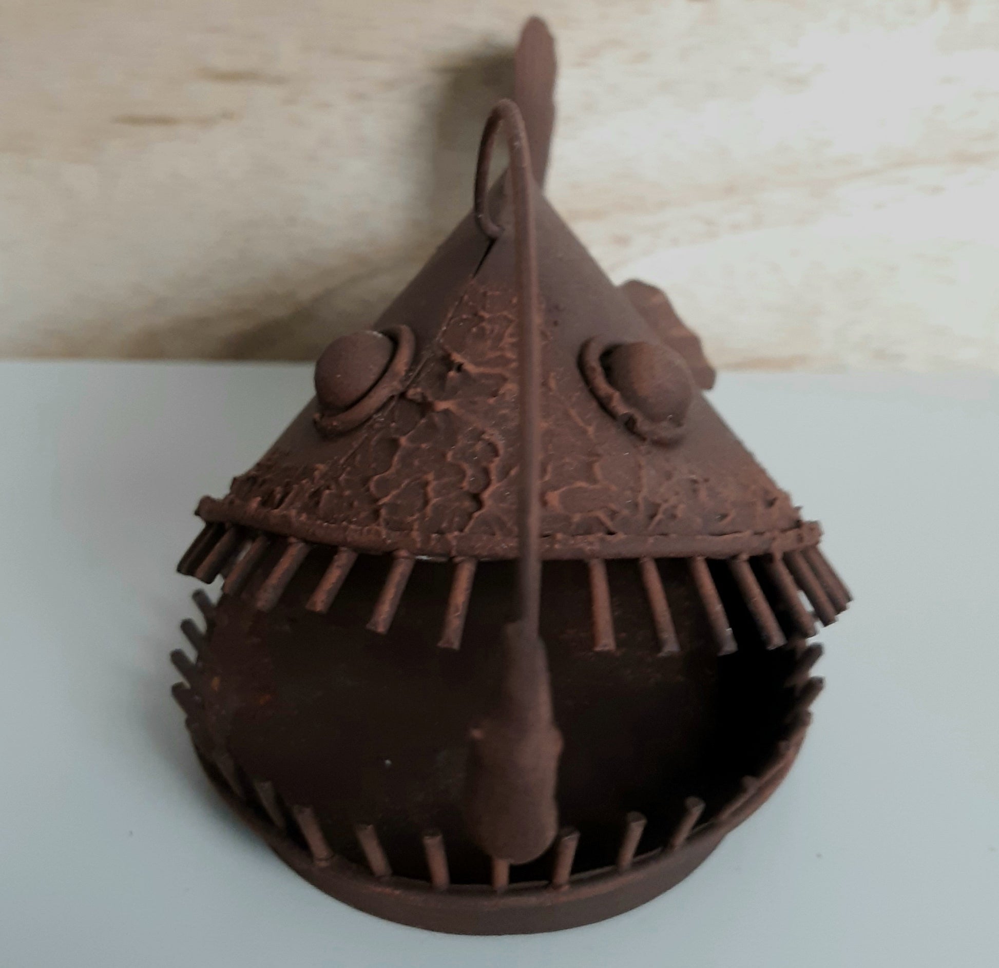 Rustic model of Allan the Anglerfish against a wooden background