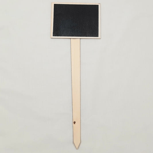 Black rectangular chalkboard sign on a wooden stand against a light gray background