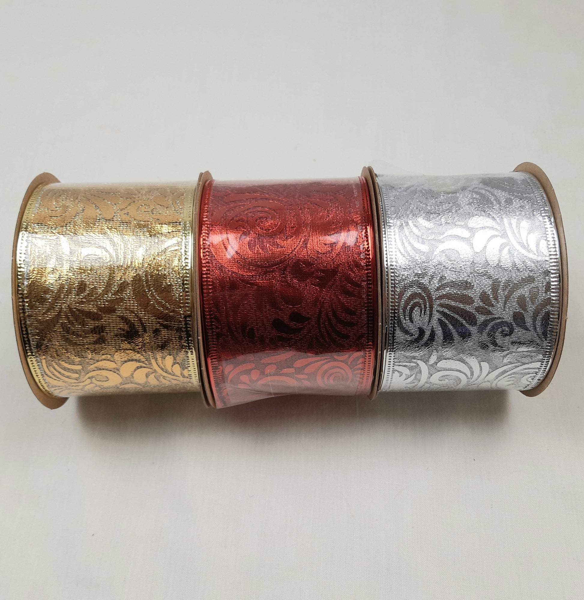 3 Reels of Damask Patterned Ribbon in Gold, Red and Silver colours.