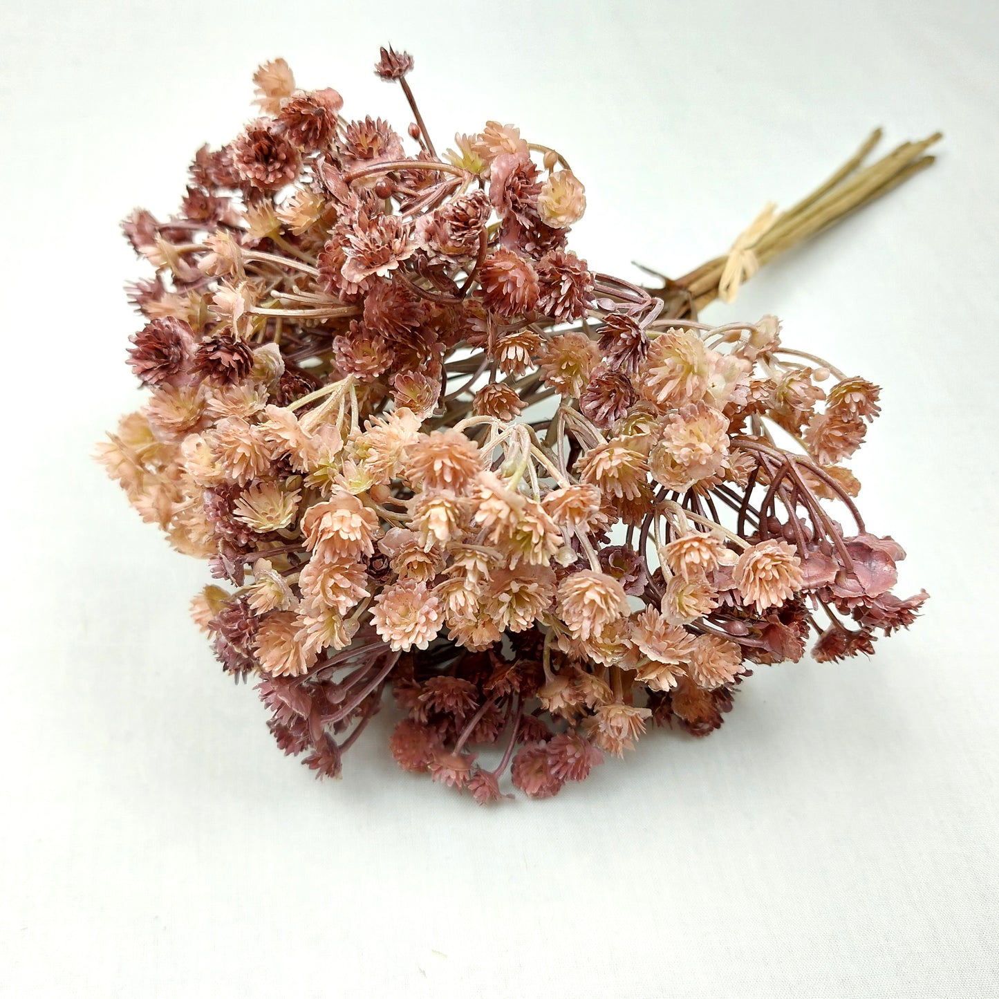 Artificial Bouquet of dried look flowers on a white background