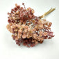 Artificial Bouquet of dried look flowers on a white background