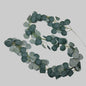 Artificial eucalyptus garland on a light gray background