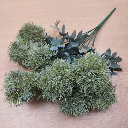 Green artificial Dianthus Green Trick plants on a wooden surface