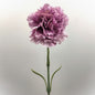 An artificial Lilac Ruffled Carnation flower with a green leafy stem against a pale background.
