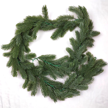 Artificial Green Spruce Garland on a white background