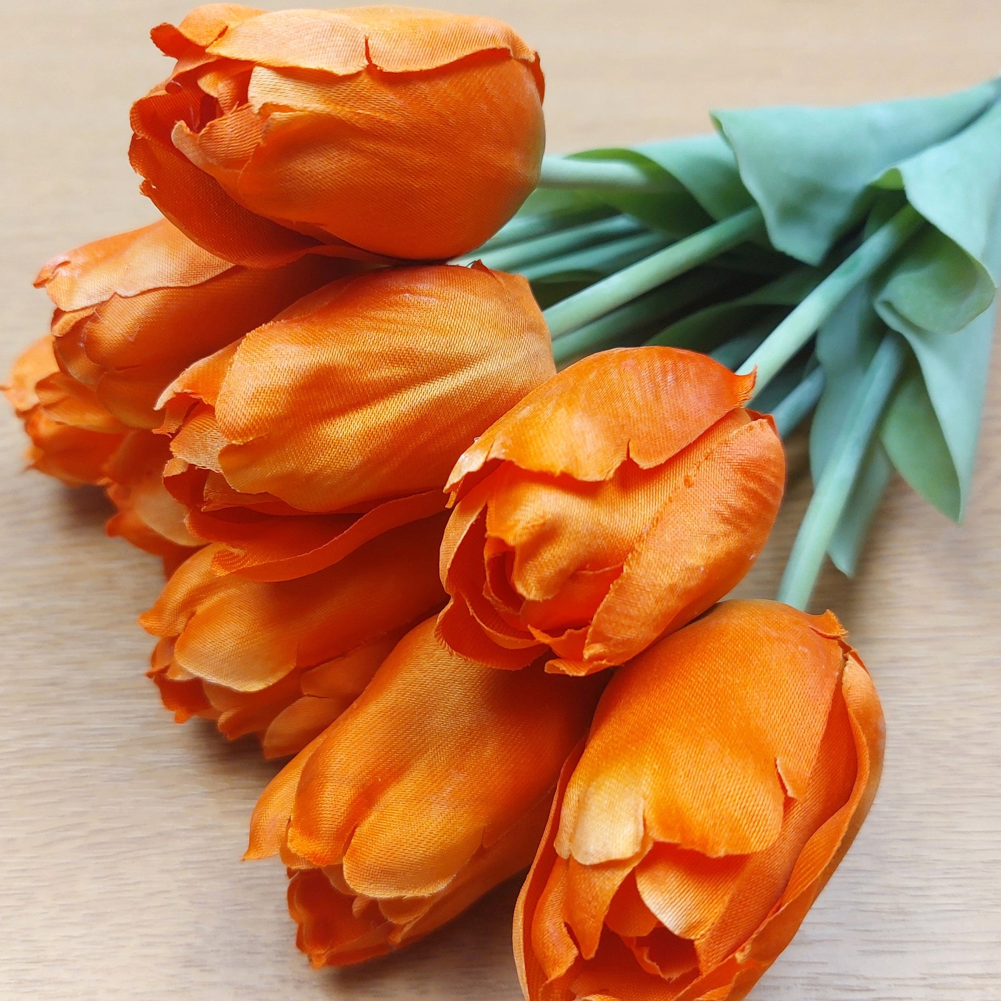 A close up of Orange artificial Tulips