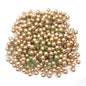 A large collection of faux wired gold berries on a white background