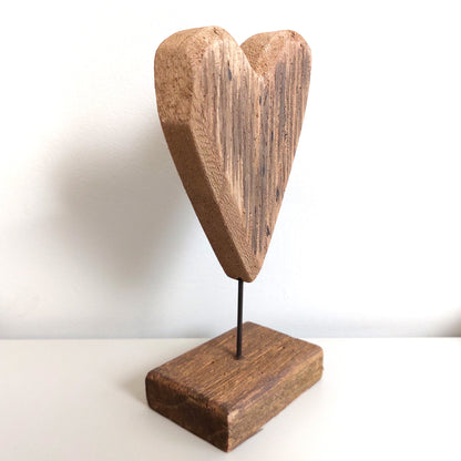 Angled Wooden heart-shaped sculpture on a white background
