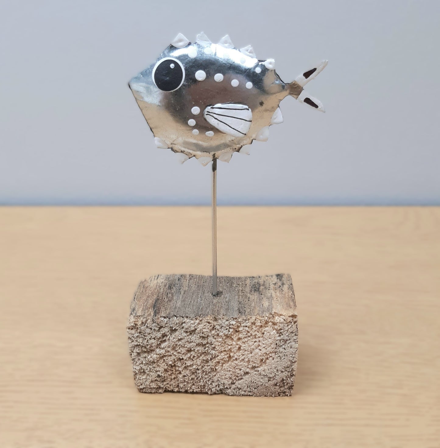 Metal Silver Fish on a wooden block