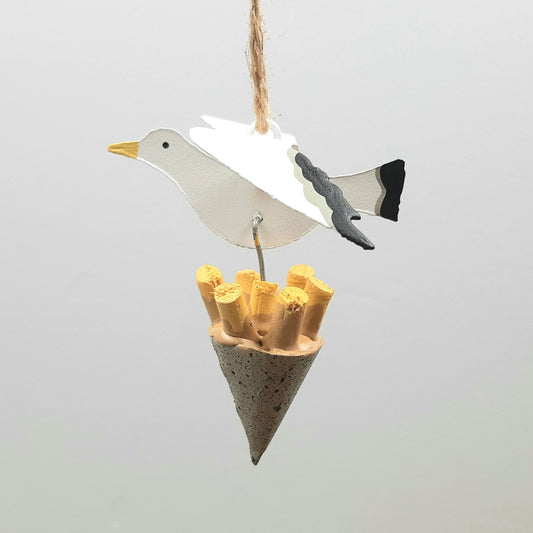 A seagull figure carrying some chips