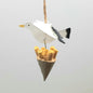 A seagull figure carrying some chips