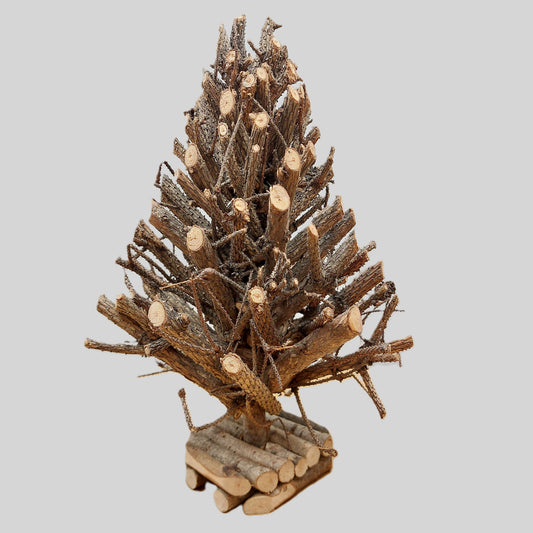 Decorative tree made of wooden branches on a gray background
