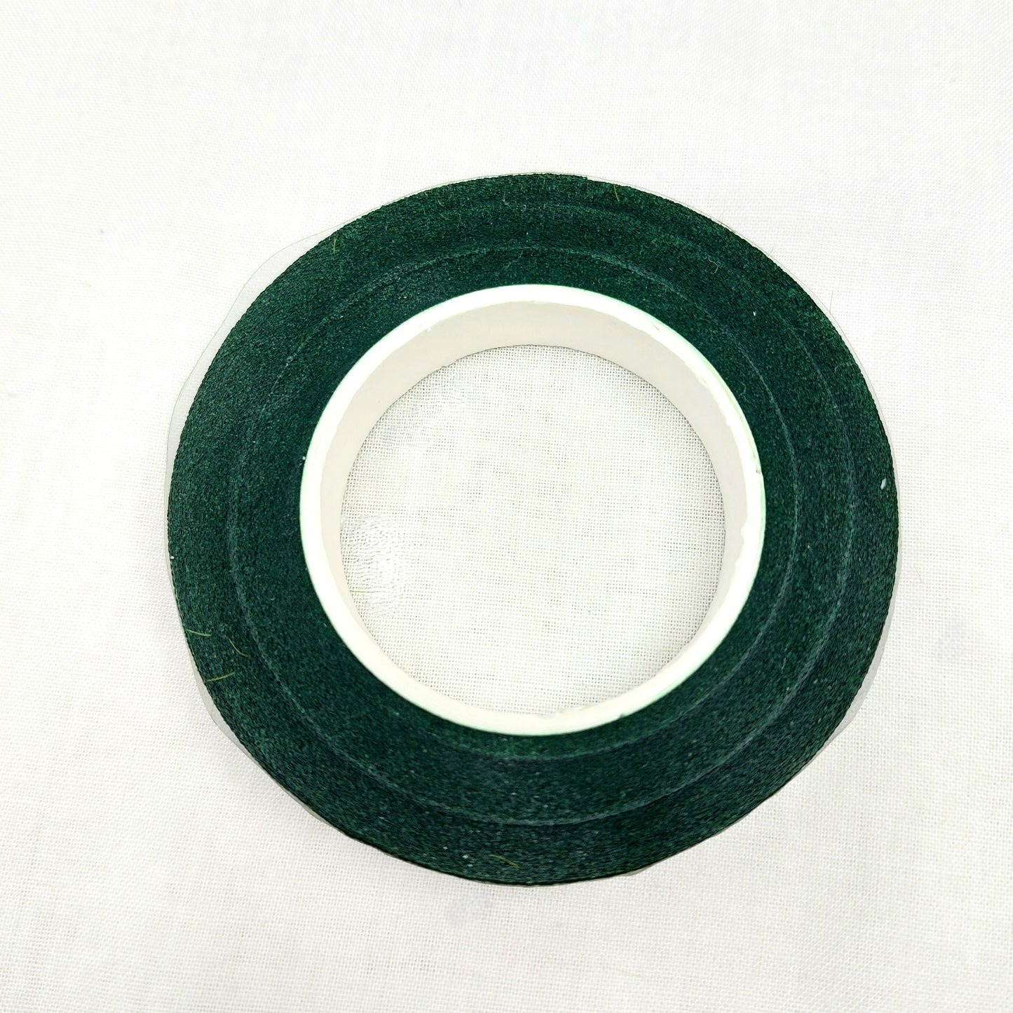 Roll of green florist tape on a white background