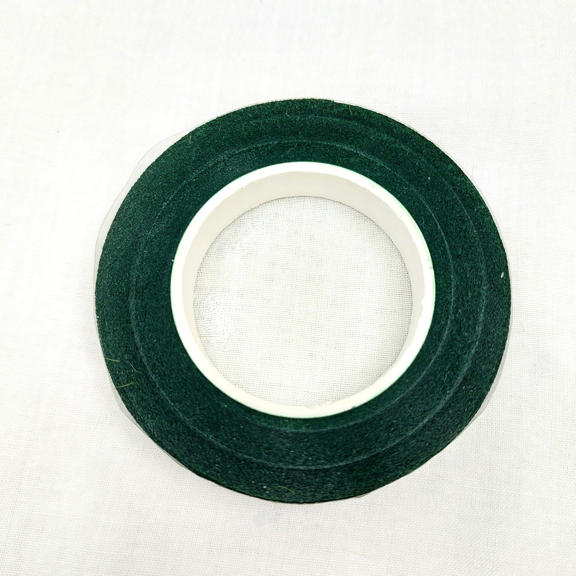 Roll of green florist tape on a white background