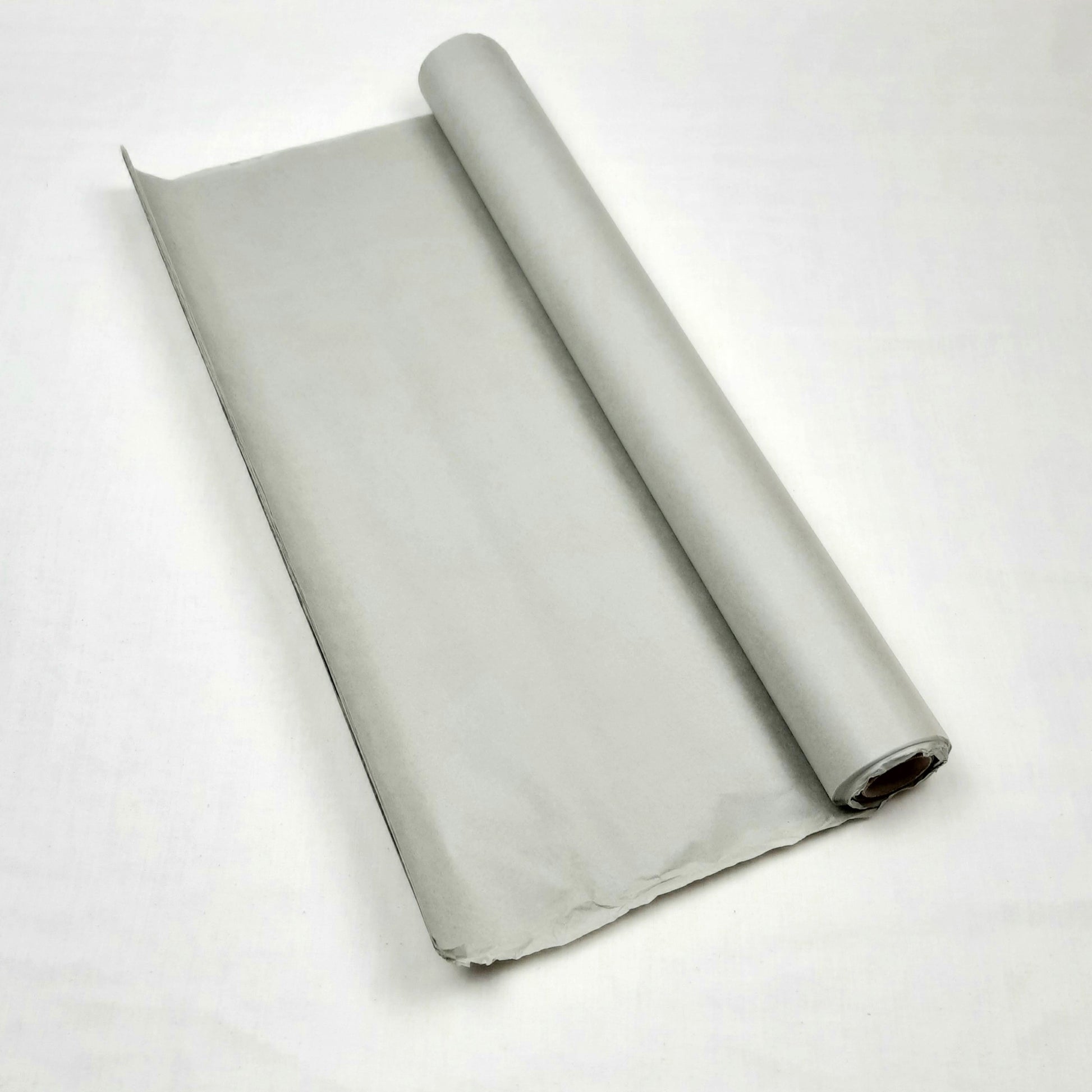 Rolled-up grey tissue paper on a white background
